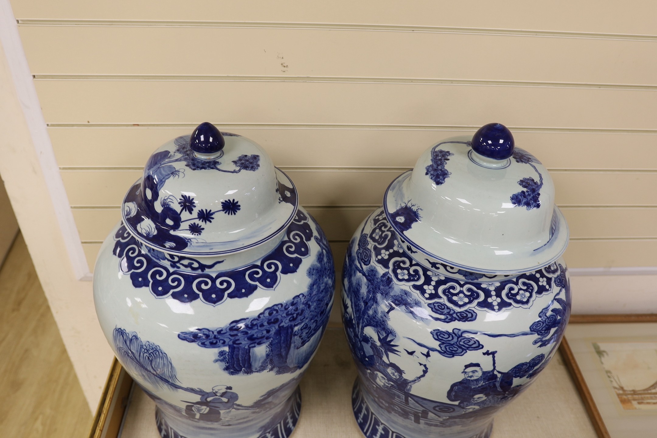 A pair of large Chinese blue and white jars and covers, 75 cms high.